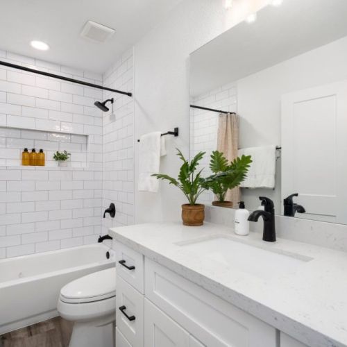Master bathroom with tiled shower and plenty of space for your morning routine.