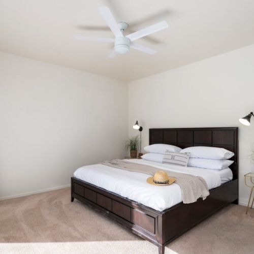 Master bedroom with king sized bed and Smart TV.