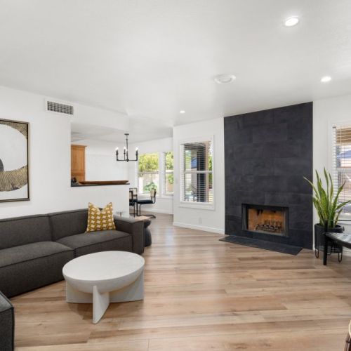 Large family room with fireplace and Smart TV