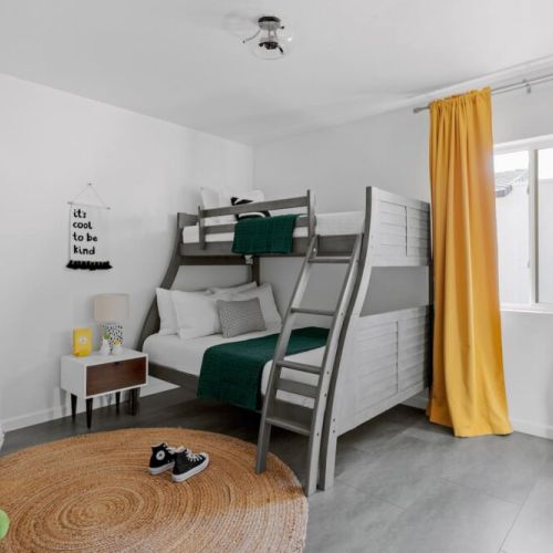 Third bedroom with Full bunk on bottom and twin on top, TV