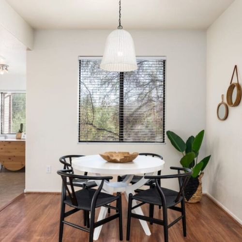 Dining area overlooking a private greenbelt.