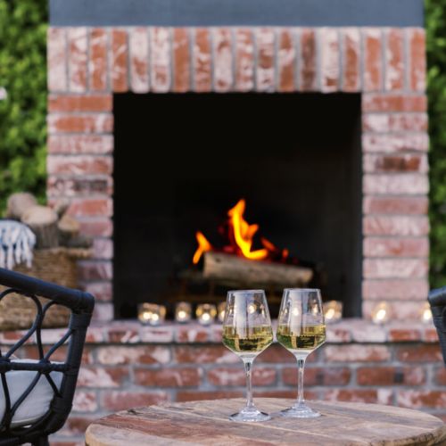 Cozy up to the outdoor fireplace with a glass of wine or roasted marshmallows.