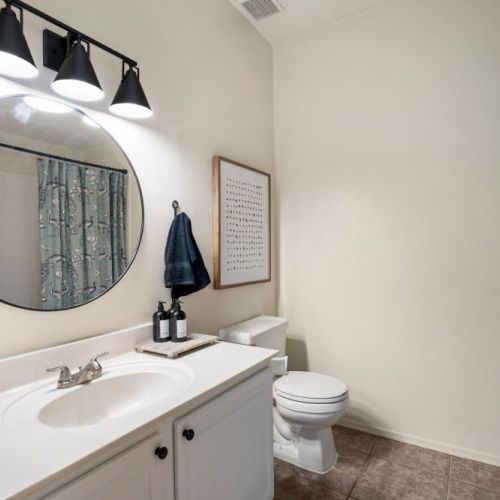 Secondary bathroom with tub and shower.