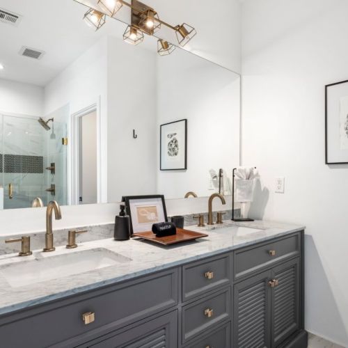 Master Bathroom with dual vanities and luxurious walk in shower