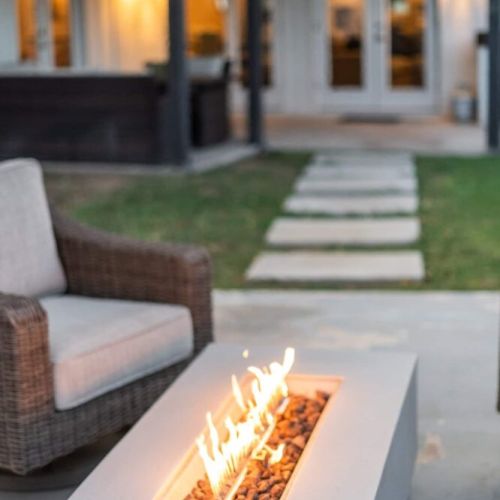 "beautiful covered seating area and fire pit.