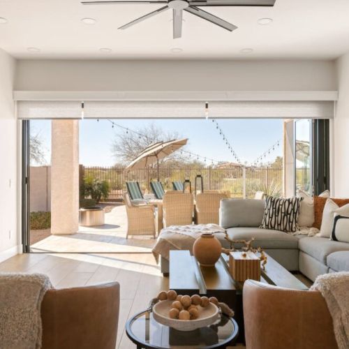 Accordion glass doors open the living room to the back yard space - truly incredible!