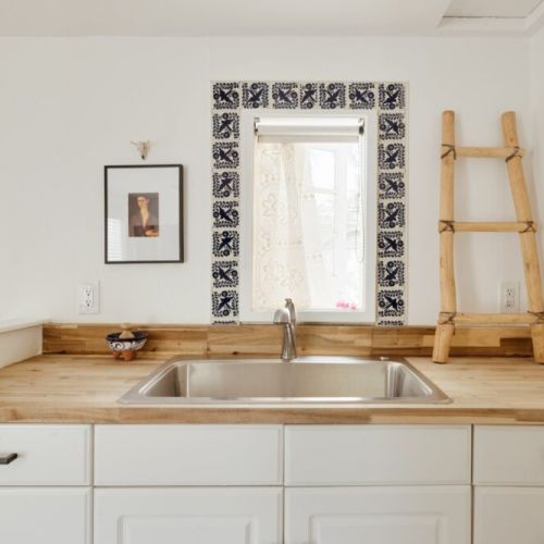 A charming kitchenette at The Frida, where rustic wood and warm desert sunlight create the perfect blend of function and Southwestern character.