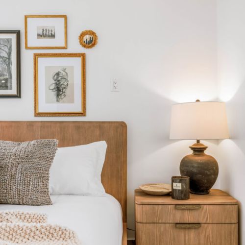 Welcoming vibes throughout the home with plush pillows and soft lighting