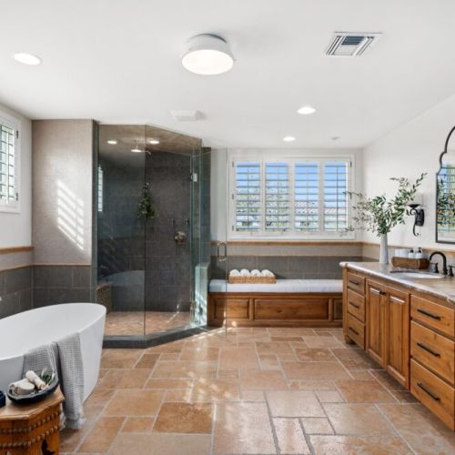 Master with deep tub and walk-in steam shower + his and hers vanities