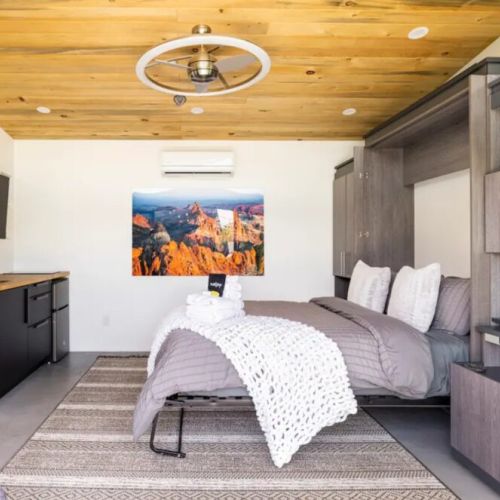 Casita queen bed with TV and mini fridge