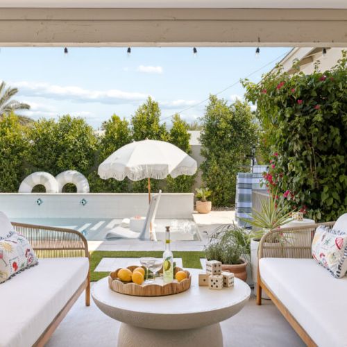 Beach umbrella, comfy seating, lush greenery, and so much more!