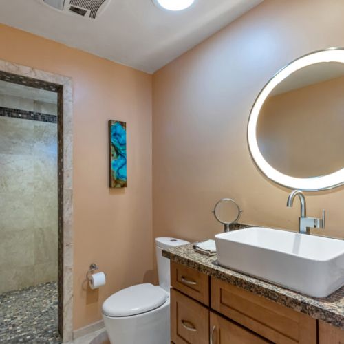 Studio bathroom with multi jetted shower