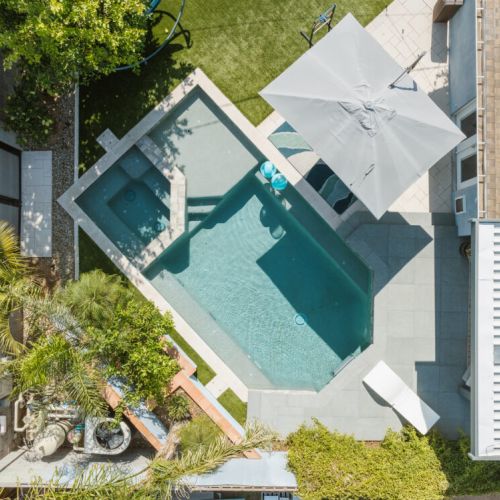 Heated pool with endless swim machine and spa.