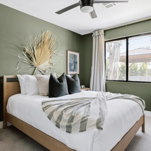 Bedroom 4 with queen bed and a view of the gorgeous backyard!