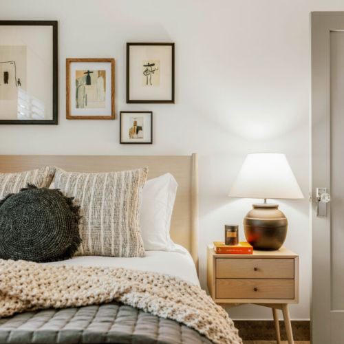 Queen bed with hotel-quality linens and curated décor with a southwest modern flare