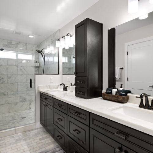 Master Walk in shower with dual vanities and luxe toiletries