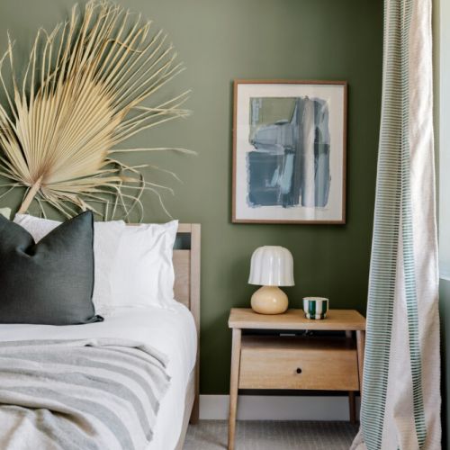 Each side of the bed has a bedside table for your personal effects