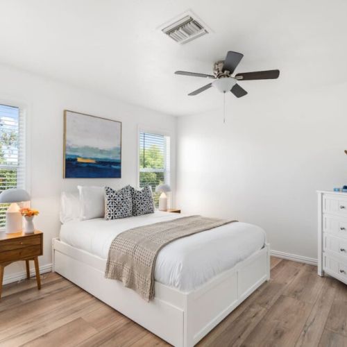 Guest bedroom 1 with queen bed and additional twin trundle