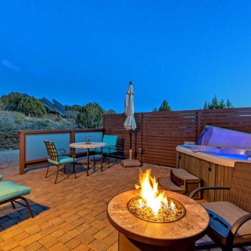 Gaze at the stars from your private patio with your very own hot tub and firepit.