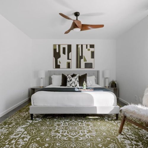 2nd Master with King Bed overlooking pool and lush backyard. TV