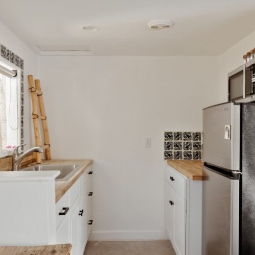 Step into a cozy and stylish kitchen designed for both functionality and charm.