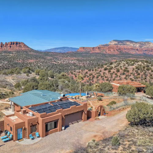 Sedona's Best Studio occupies the area to the left of the Garage.  The main home is under the green roof which is also available for larger groups.  Our Airbnb Casita sits outside the fence lower down the hillside.