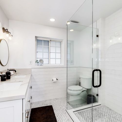 Master Bathroom Retreat with walk in shower, luxury linens , eco friendly toiletries and custom glass surround.