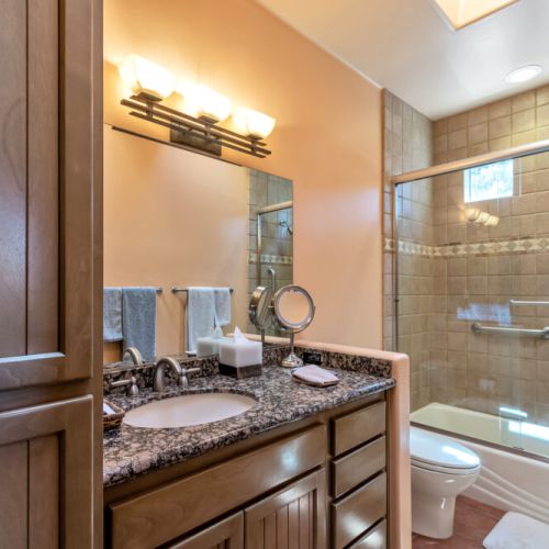 Villa Master bathroom with tub and shower