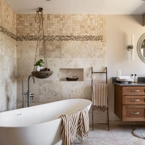 Master bathroom with two vanities + stand alone tub.