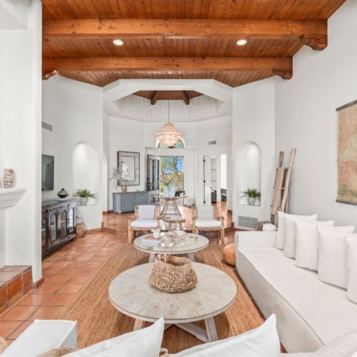 The open layout invites you to explore, from the cozy living areas adorned with artisanal touches to the tranquil outdoor spaces that offer breathtaking views of vibrant sunsets.