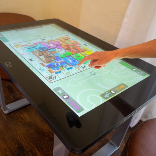 Infinity digital game table for up to 6 players featuring dozens of games