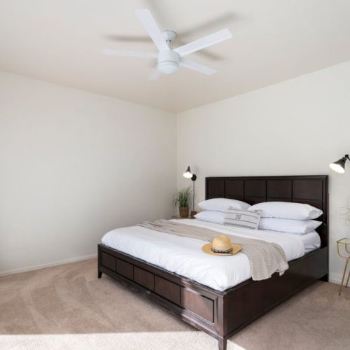 Master bedroom with king sized bed and Smart TV.