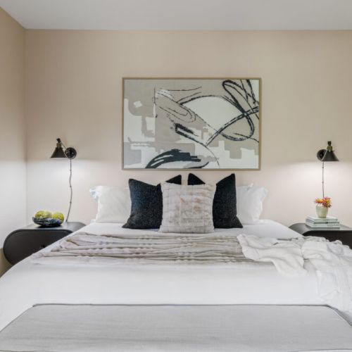 A moody, elevated bedroom designed for deep rest and high-end comfort.