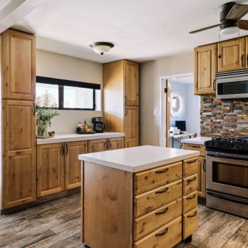 Family meal headquarters with ample prep space, quality cookware, and complimentary spices.