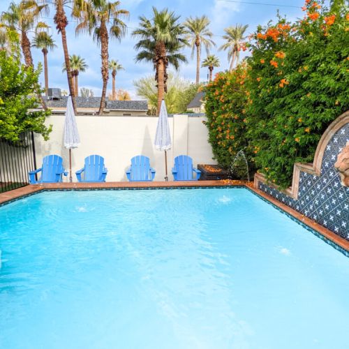 Heated pool with plenty of pool floats, poolside seating