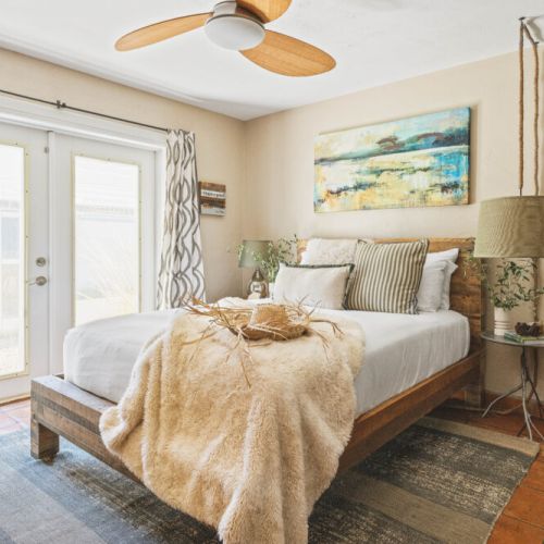 Bedroom 3 with Queen bed with private bathroom and Roku TV for evening entertainment. Direct access to the lush outdoor space.