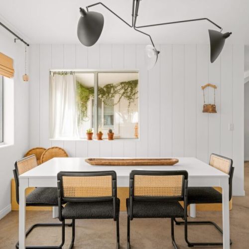 Dining area with built in bench, overlooking the backyard