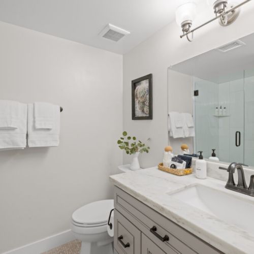 First floor full bathroom with walk-in shower, fluffy towels + eco-friendly toiletries