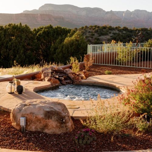 Inground hot tub with rock inlays