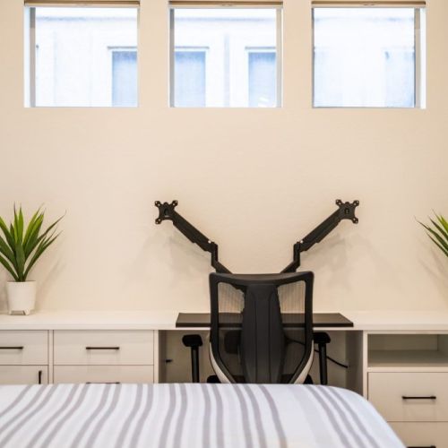 Secondary bedroom has a Murphy bed and large desk for the perfect work-cation.
