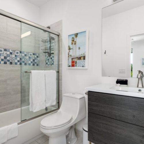 Tub + shower combo with ample vanity space, eco friendly soaps and fluffy towels.