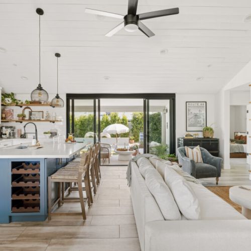 Open concept with sliding glass doors leading to the backyard oasis